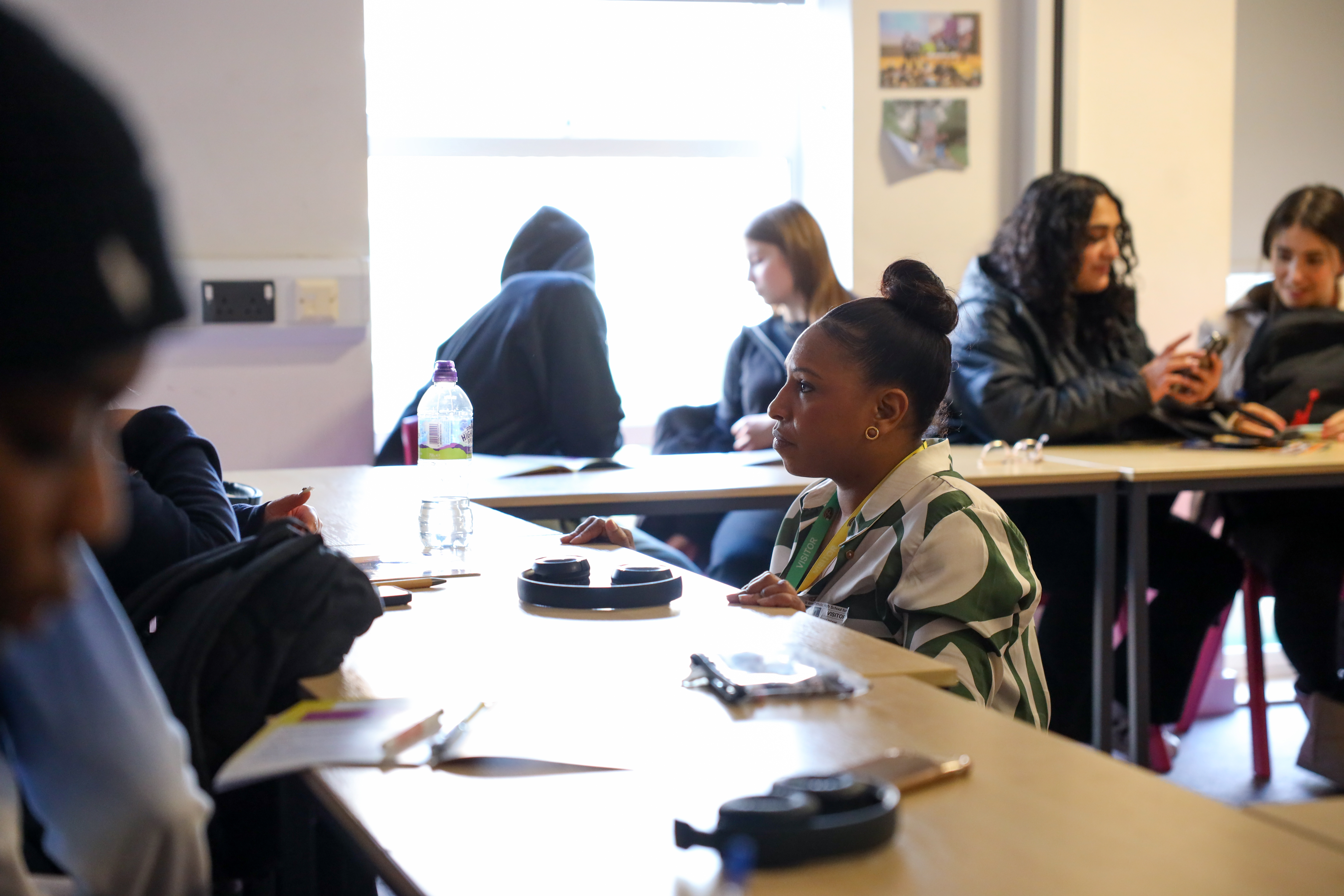 Facilitator leading a classroom workshop on money management